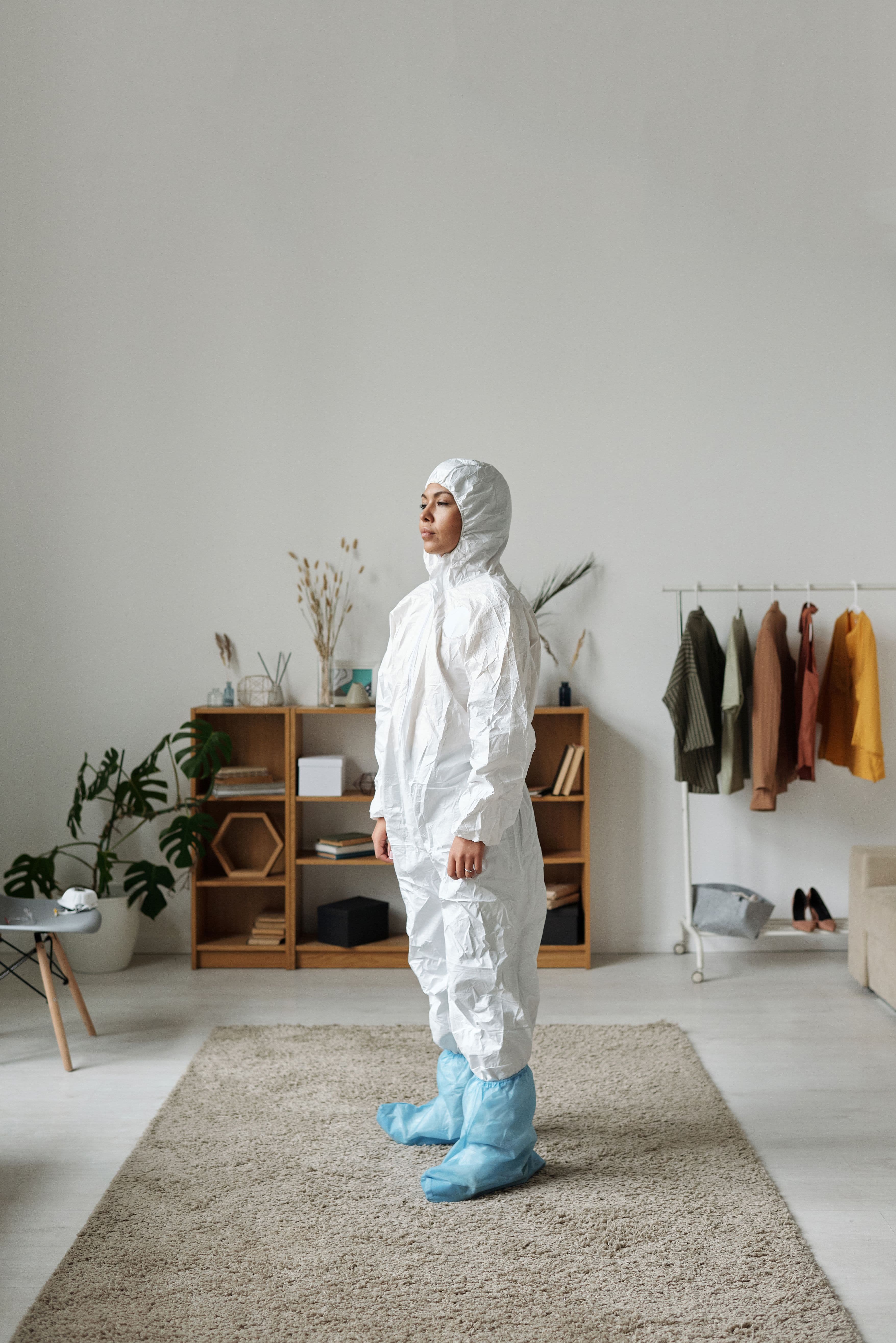 Cleaner wearing protective gloves preparing specialist cleaning products