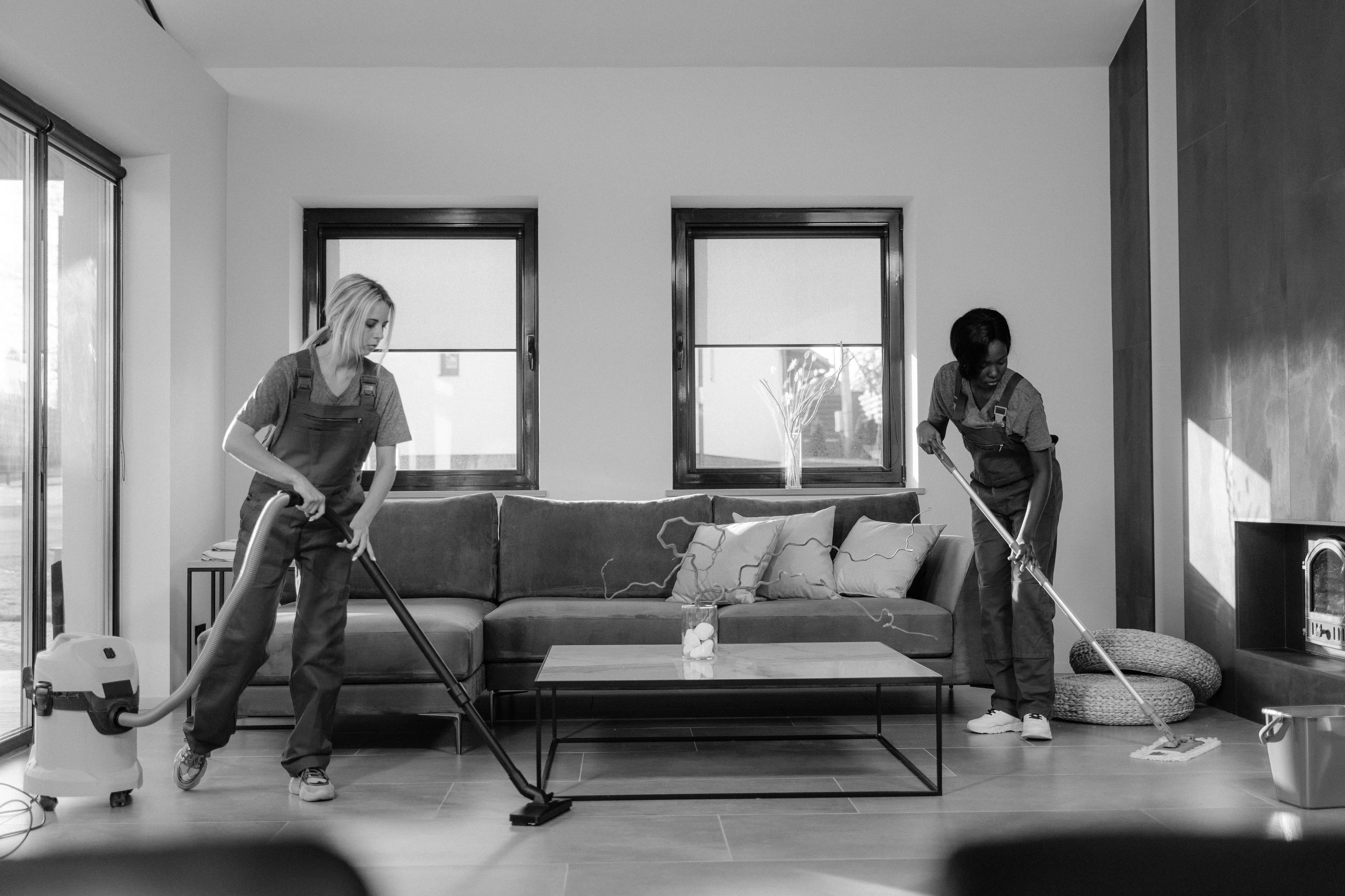 Cleaning team maintaining a shared residential interior