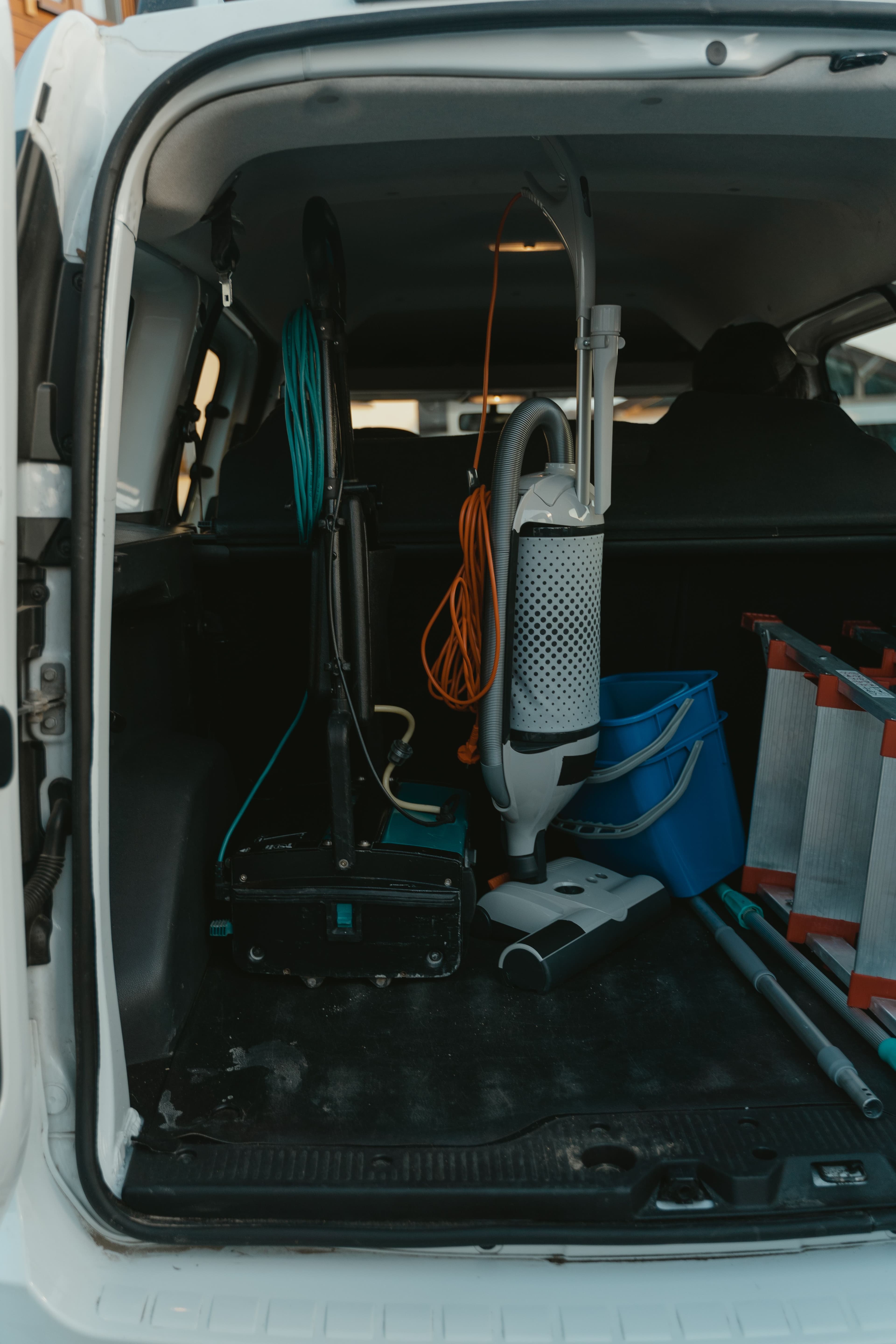 Cleaning staff preparing equipment for a shared residential environment